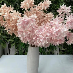 Huitich artificial orchid flower garland in pink and peach shades arranged in white vase