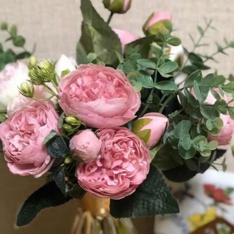 Huitich artificial peony bouquet with pink blooms and green foliage in a decorative arrangement