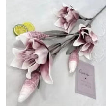 Artificial pink flower garland with tag, three blossoms, and striped dangling accents