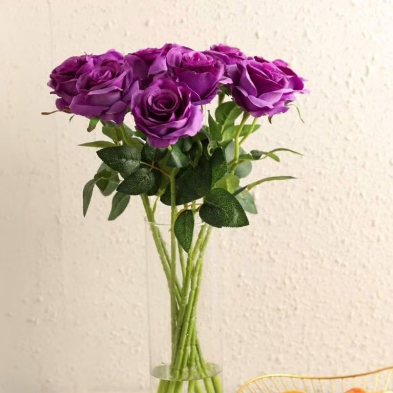 Huitich artificial purple rose buds bouquet with green leaves in a clear glass vase