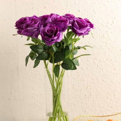 Huitich artificial purple rose buds bouquet with green leaves in a clear glass vase