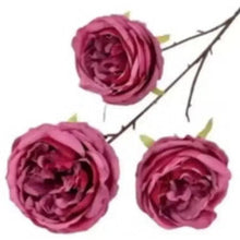 Artificial red rose flowers, three blooms with wire stems and green leaves