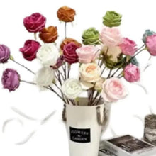Artificial rose bouquet in beige vase, mixed-color blooms with green leaves and wire stems