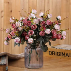 Artificial red peony bouquet by Huitich displayed in a clear ribbed glass vase on wooden table