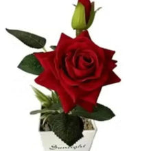 Artificial red rose potted plant decor with green leaves in a gray pot