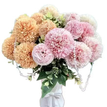 Artificial rose flower bouquet in white vase, pink and beige blooms with green leaves