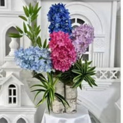 Huitich artificial rose flowers for home decor in vibrant pink purple and blue arranged with green leaves