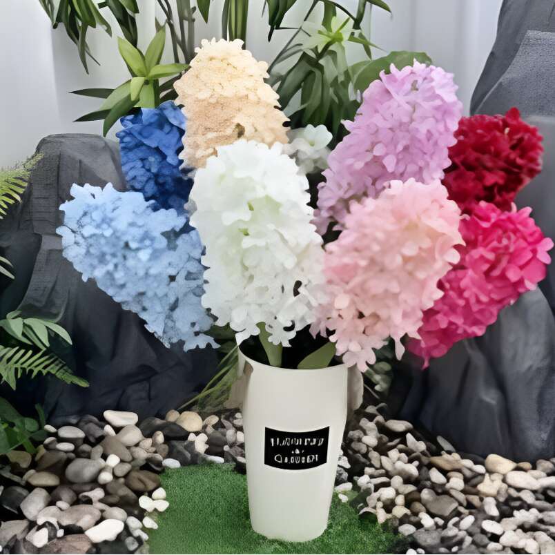 Colorful artificial rose flowers for home decor arranged in a white vase by Huitich