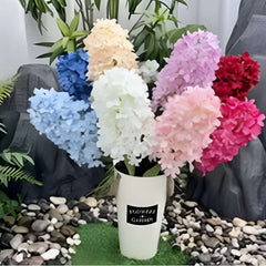 Colorful artificial rose flowers for home decor arranged in a white vase by Huitich