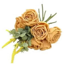 Artificial golden rose bouquet with three rosette flowers and green leaf accents