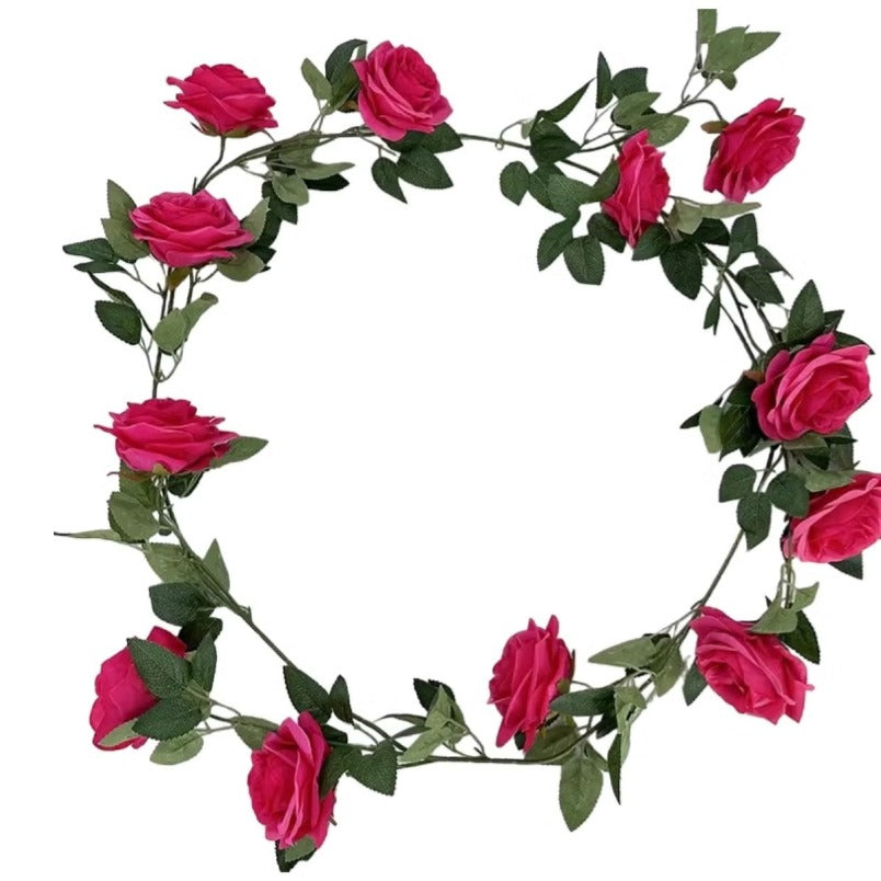 Huitich artificial rose wall decor featuring vibrant pink artificial flowers with green leaves arranged in a circular garland
