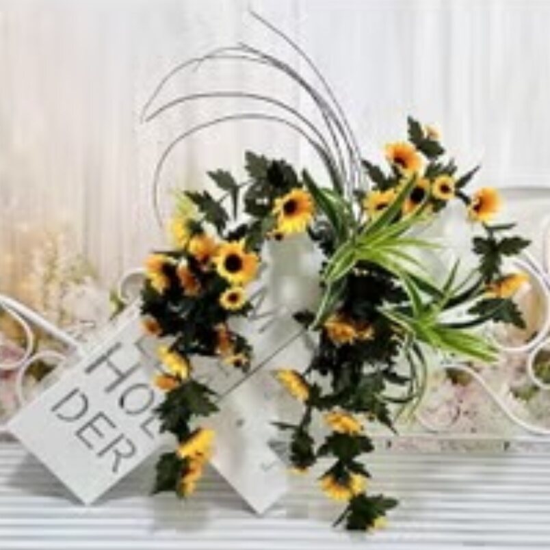 Huitich artificial sunflower wall hanging with vibrant yellow flowers and green leaves in a decorative style