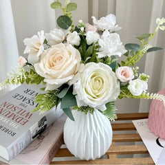 Huitich artificial white flower decor in a white textured vase on a wooden table with books