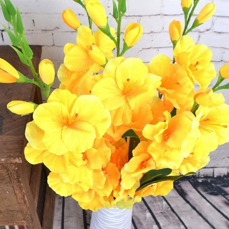 Huitich artificial yellow dendrobium flowers bouquet in white vase with green stems and buds