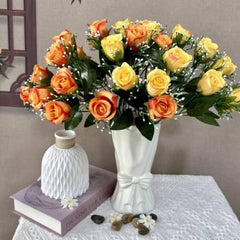 Huitich artificial yellow flowers for home decor arranged in white vase with orange and yellow roses