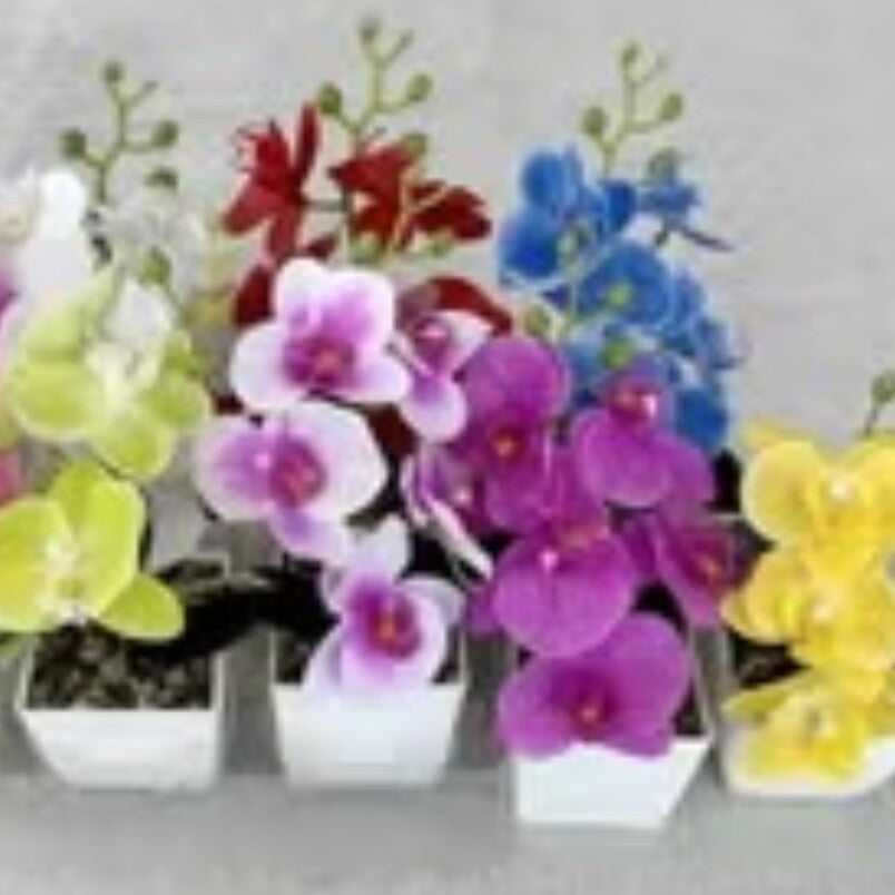 Artificial yellow orchid bonsai among colorful artificial flowers in white pots by Huitich