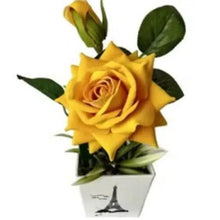 Artificial yellow rose potted plant decor with green leaves in light gray Eiffel Tower pot