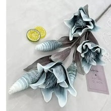 Blue artificial flower decor with hanging tag and layered petals on ridged stems
