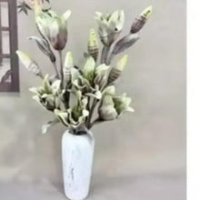 Artificial green flower bouquet in white vase