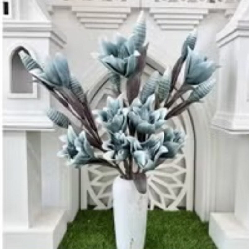 Huitich blue flower decor for home displayed in a white vase with green grass background