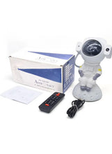 White astronaut night light set with gift box, remote, and power cord