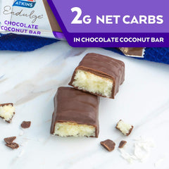 Atkins chocolate coconut bars UAE image of two chocolate coated coconut bars cut open showing creamy coconut filling and packaging