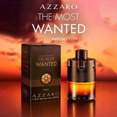 Azzaro The Most Wanted Parfum for men bottle and packaging against a sunset background