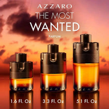 Three men's parfum bottles in black with amber liquid, varying sizes