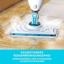 Steam mop with blue-striped replacement pad gliding on tile floor