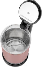 Pink glass electric kettle with open lid and black base, showing empty interior