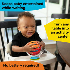 Ba Einstein baby in high chair playing with colorful suction ball baby high chair activity toy on tray