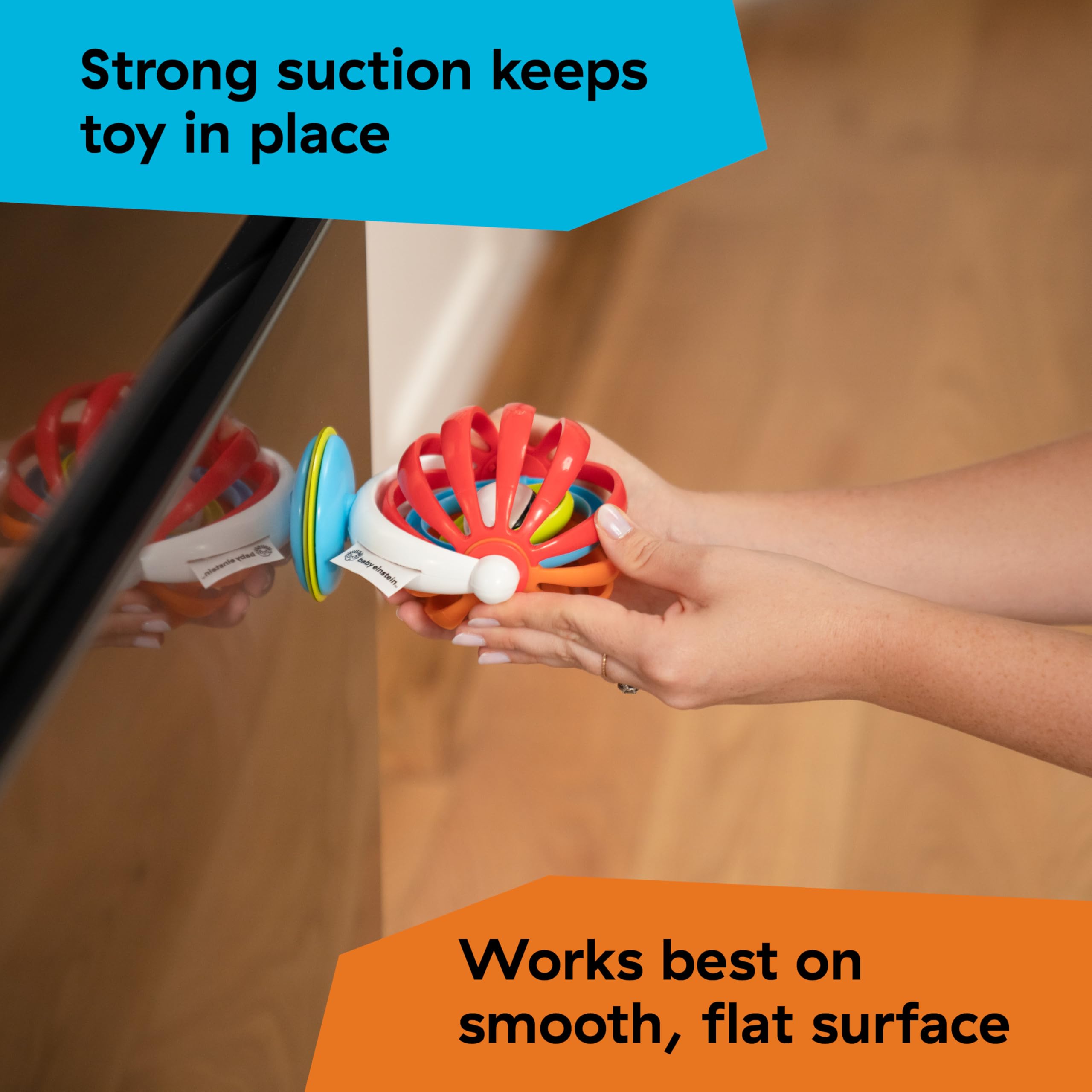 Ba Einstein baby high chair activity toy colorful suction ball attached to smooth flat surface by adult hands