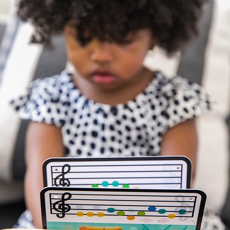 Baby playing with Huitich wooden Baby Einstein Magic Touch Piano educational toy