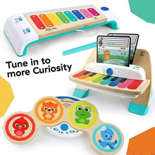 Children’s wooden music toy piano with rainbow keys, tablet display, and speaker base