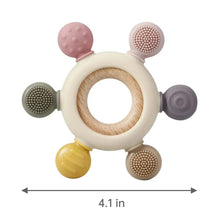 Silicone baby teething toy with wooden ring, pink nub, and textured side pads