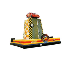 Inflatable rock climbing play structure with gray ramp wall and red top car graphic