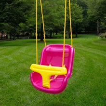Pink swing seat with yellow bar suspended by two ropes in a yard