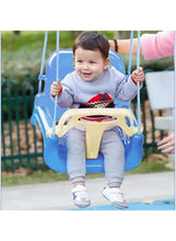Blue baby swing chair with child in seat, overhead hanging ropes and safety bar