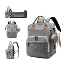 Gray diaper backpack set with quilted front, tan accents, adjustable straps, side pouch