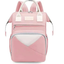 Pink baby travel backpack with white trim, front zipper pocket and top handle