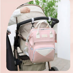 Huitich baby travel backpack pink hanging on stroller handle with multiple compartments