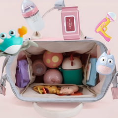 Open Huitich baby travel backpack pink showing organized baby toys, bottles, and accessories inside
