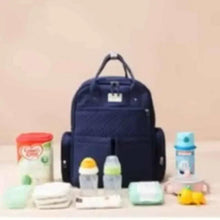 Navy baby travel bag with top handle, shown with bottles and wipes