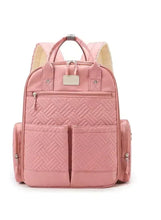 Pink baby travel backpack with central divider, front zip pockets and side carry straps