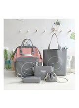 Grey and pink baby travel bag set with matching tote, backpack, and small pouch
