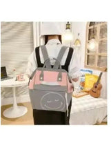 Grey and pink baby travel backpack with shoulder straps and front gray face patch
