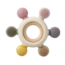 Pink and gray silicone baby teething toy with wooden ring and textured handles