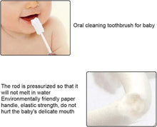 Baby oral cleaning toothbrush with white sponge tip on a stick