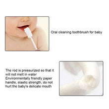 Baby tongue cleaning toothbrush with white sponge tip on a stick