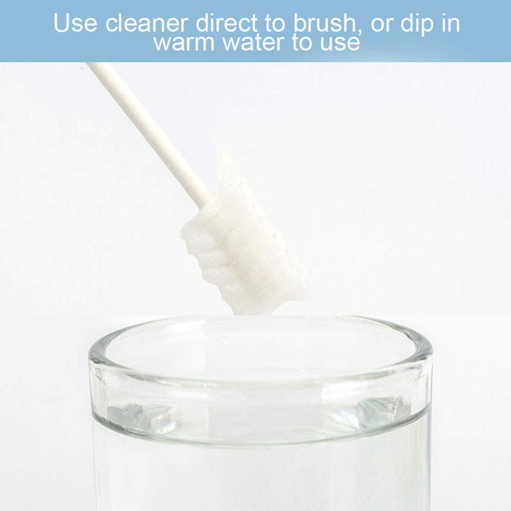 Ccy baby oral cleaner for infants white foam brush on handle being dipped into a glass of water